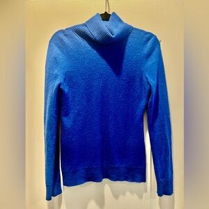 Bright blue turtleneck sweater